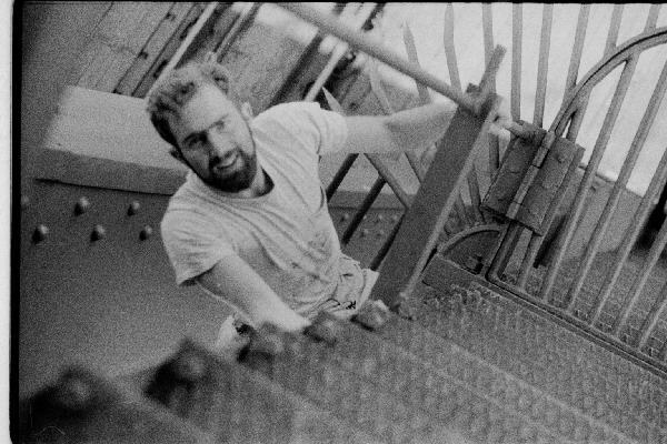 Climbing over bridge barrier