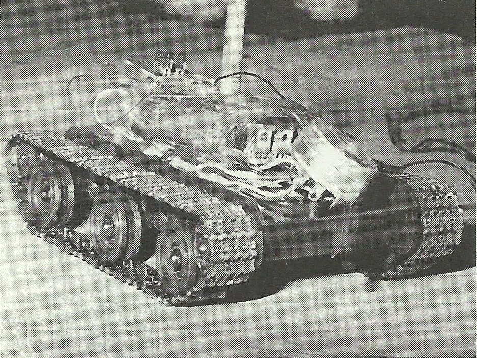 Rather than re-engineer the tank and power the tracks by stepping motors,
the controller monitored the DC motor feed and counted pulses on the motor feeddue
to the rotation of the commutator through the brushes.